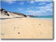 Fotografie Altro - Panorami - Spiaggia del Mal Nombre. Sabbia e rocce nere e mare azzurro
