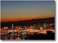 Foto Genova - Panorami - Tramonto su porto antico e lanterna di genova