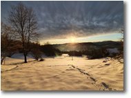 Foto Savignone - Panorami - Ombre del tramonto sui prati innevati a Montemaggio