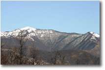 Foto ValBrevenna - Paesi - March: snow on the top of  M. Antola 